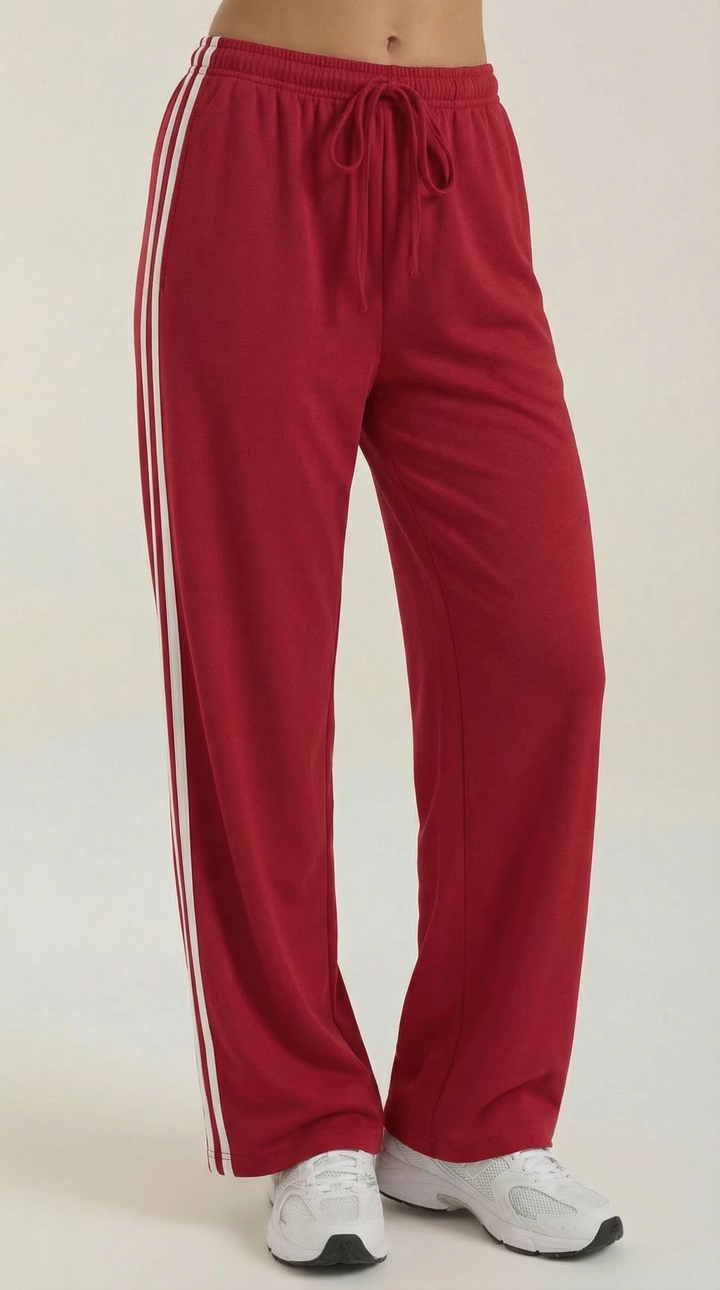Pantaloni sportivi da donna a gamba larga con righe laterali