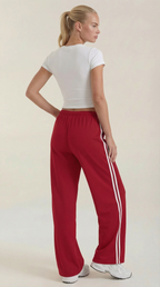 Pantaloni sportivi da donna a gamba larga con righe laterali