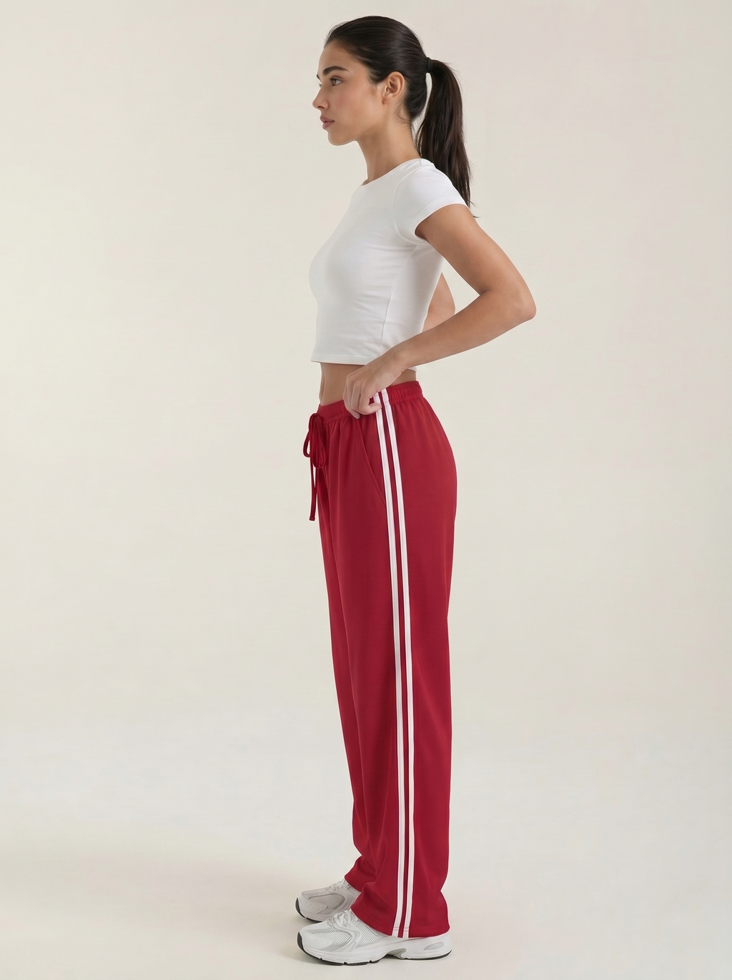 Pantaloni sportivi da donna a gamba larga con righe laterali