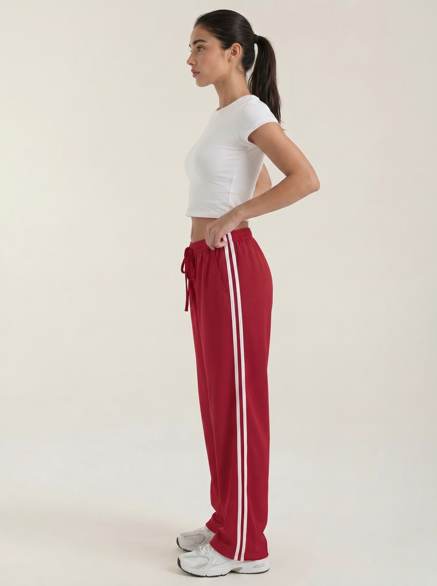 Pantaloni sportivi da donna a gamba larga con righe laterali