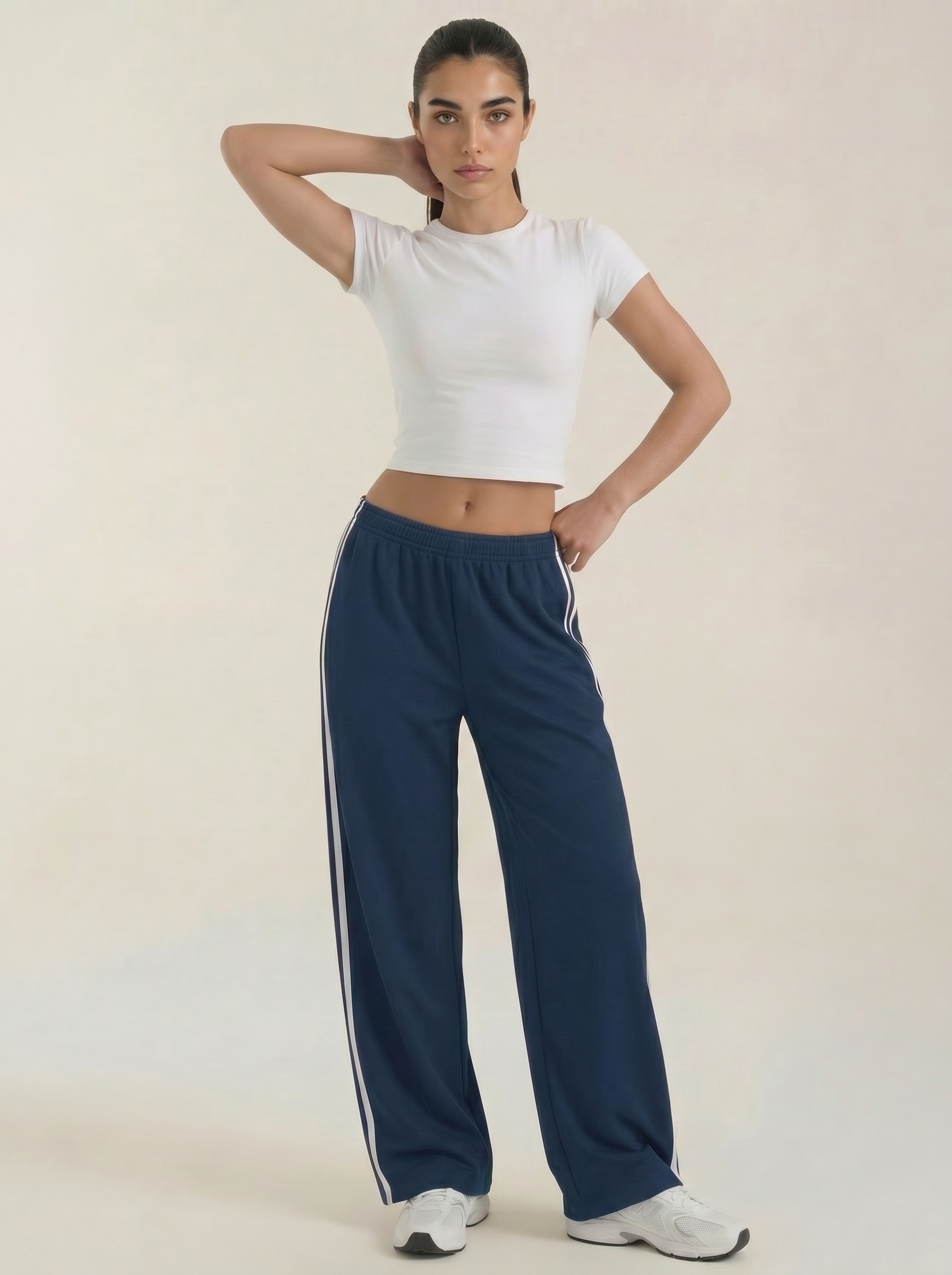 Pantaloni sportivi da donna a gamba larga con righe laterali